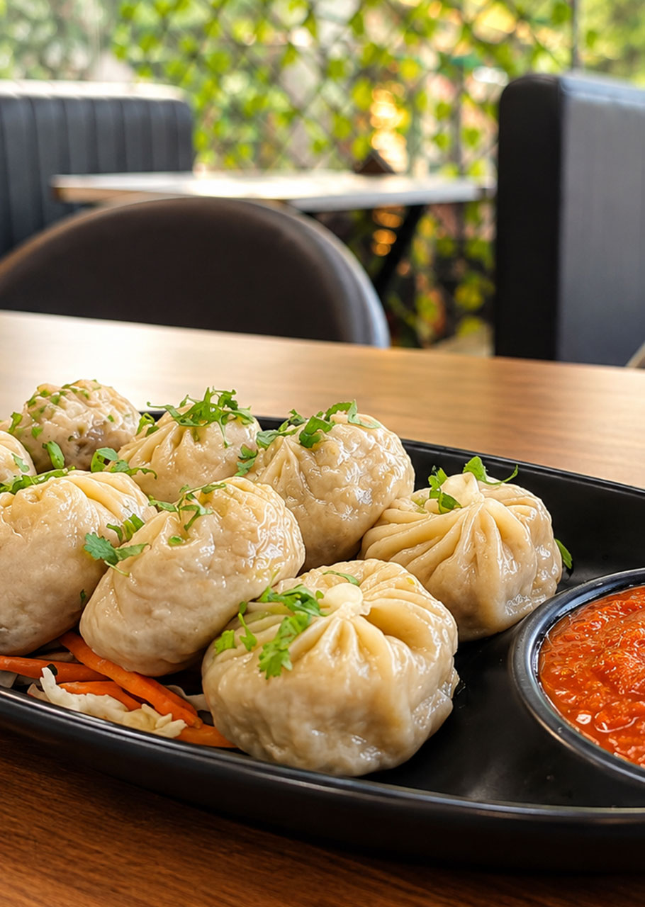 Momos served with dipping sauce